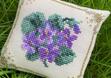 Violets pincushion by @tamara_cross_stitch